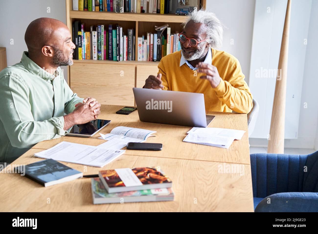 Father and son discussing with each other at home Stock Photo