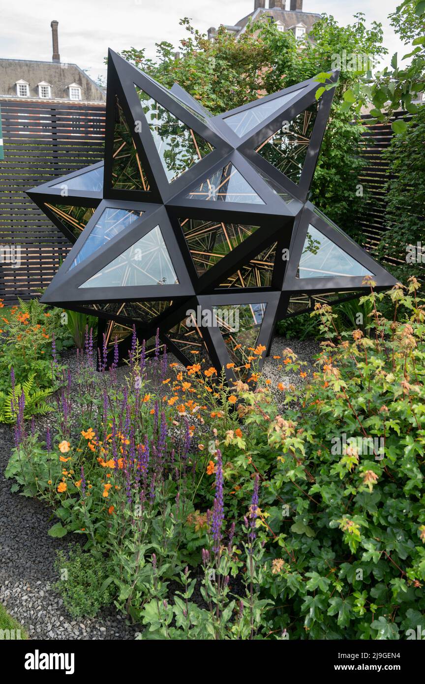 Royal Hospital, Chelsea, London, UK. 23 May 2022. The RHS Chelsea Flower show opens to the press. Saatchi Gallery Garden 281, featuring works by London-born artist Anthony James. Credit: Malcolm Park/Alamy Live News Stock Photo
