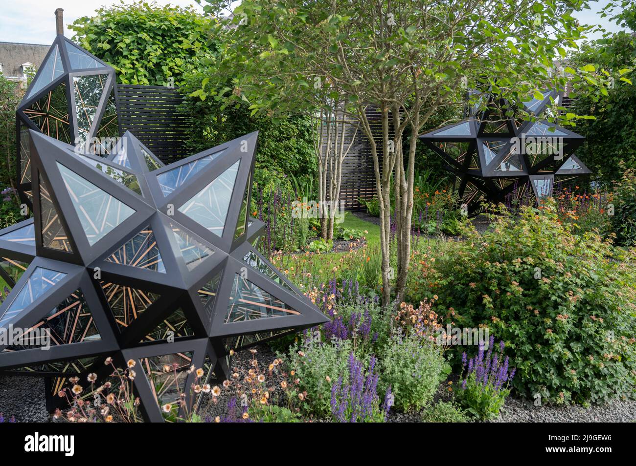 Royal Hospital, Chelsea, London, UK. 23 May 2022. The RHS Chelsea Flower show opens to the press. Saatchi Gallery Garden 281, featuring works by London-born artist Anthony James. Credit: Malcolm Park/Alamy Live News Stock Photo