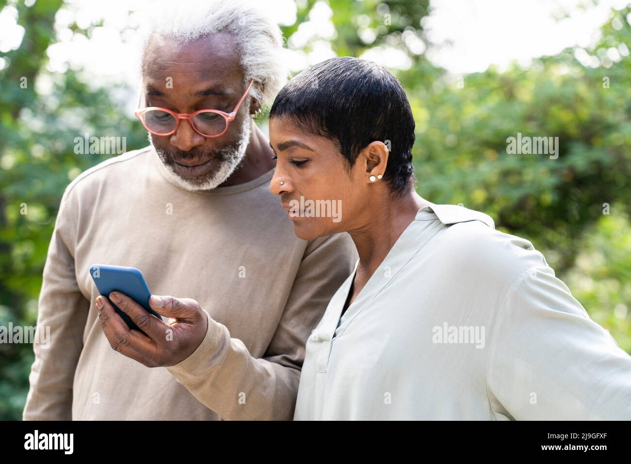 Couple using smart phone Stock Photo