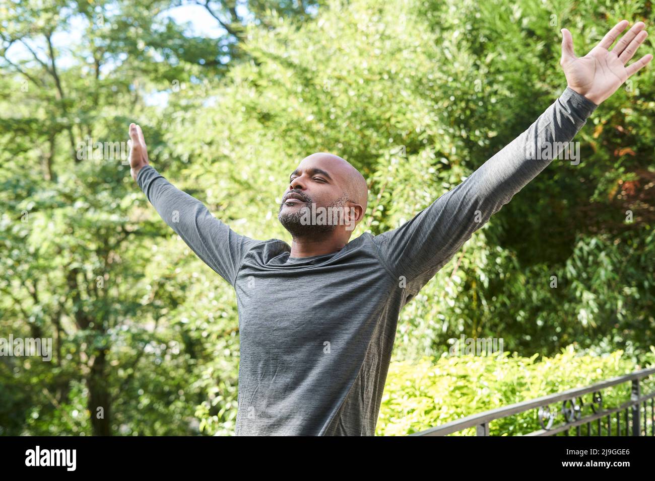 Man stretching his arms Stock Photo