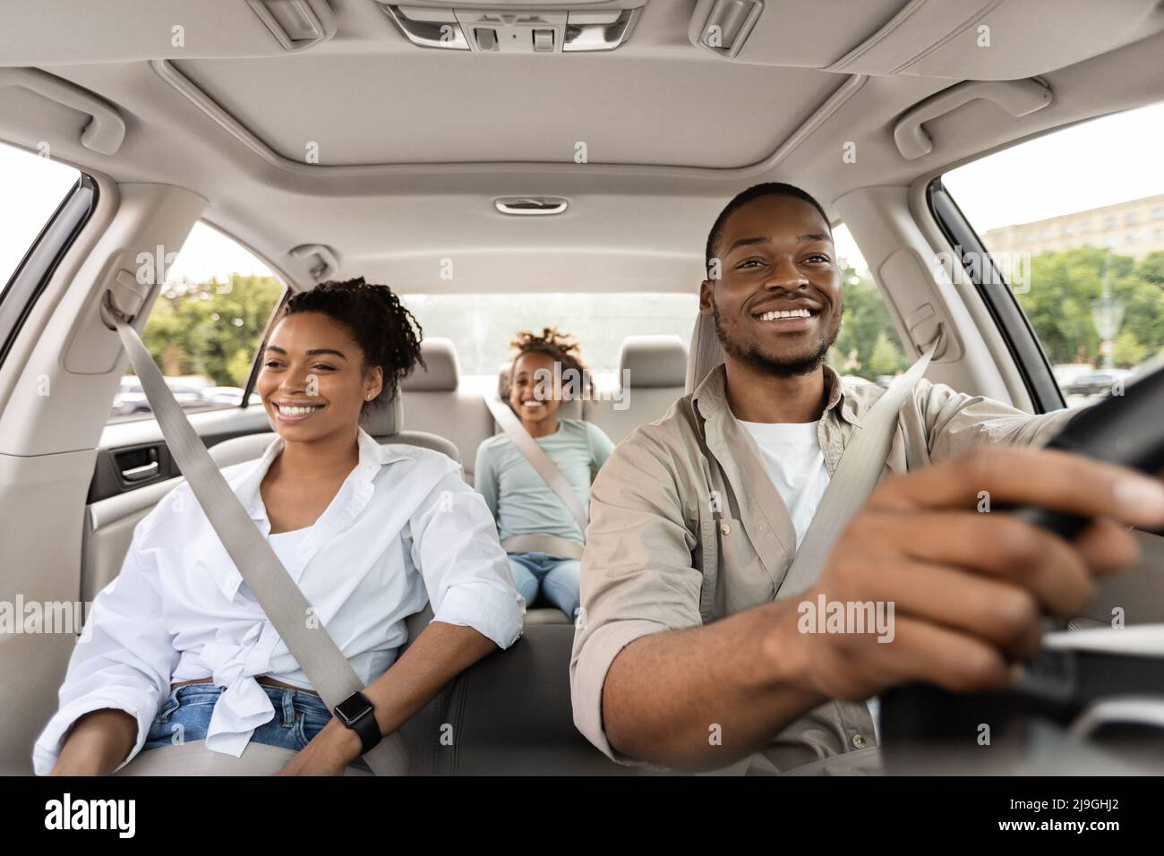 Cheerful African American Family Riding New Automobile Traveling On Vacation Stock Photo
