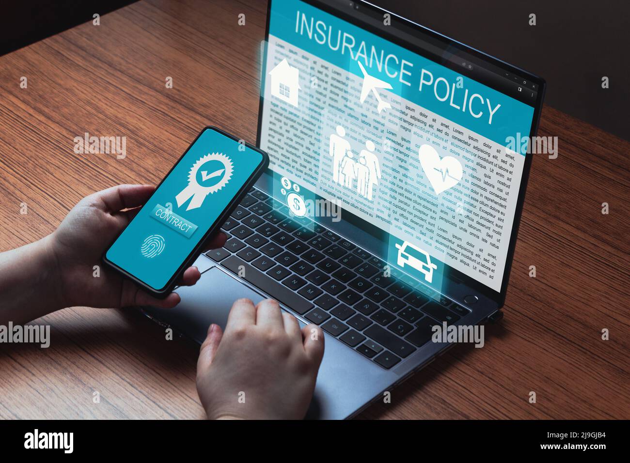 Woman use laptop and smartphone to contract family life insurance and policy. Car, family, life, travel and health insurance icons. Stock Photo