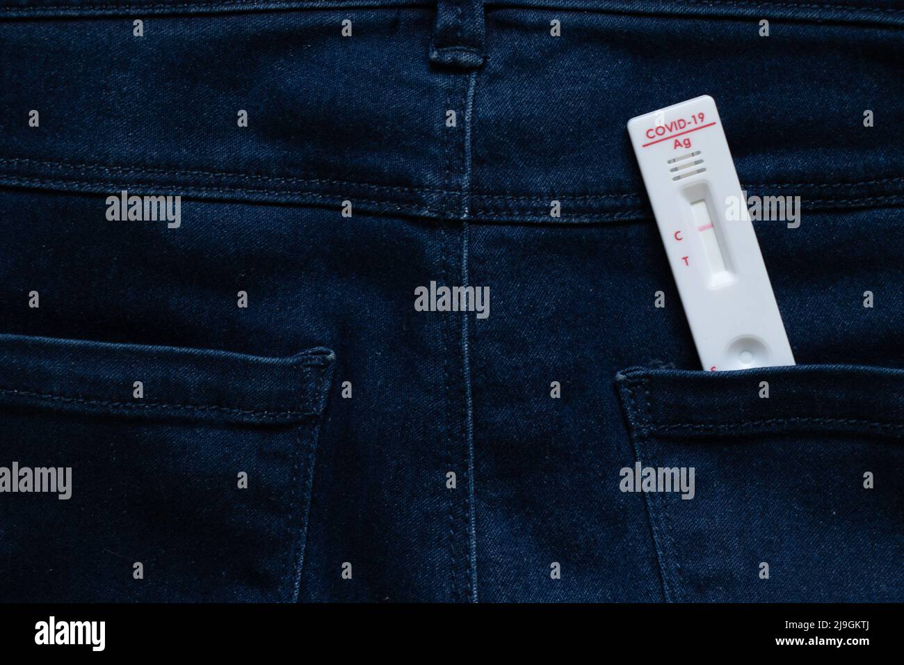 Negative covid test lies on jeans, antibody test Stock Photo