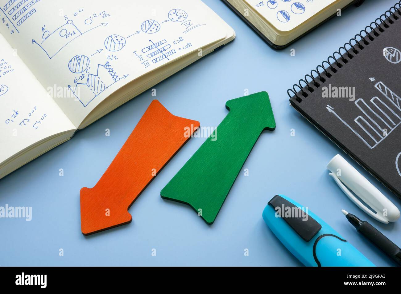 Red and green arrows as symbols of trends in business. Stock Photo