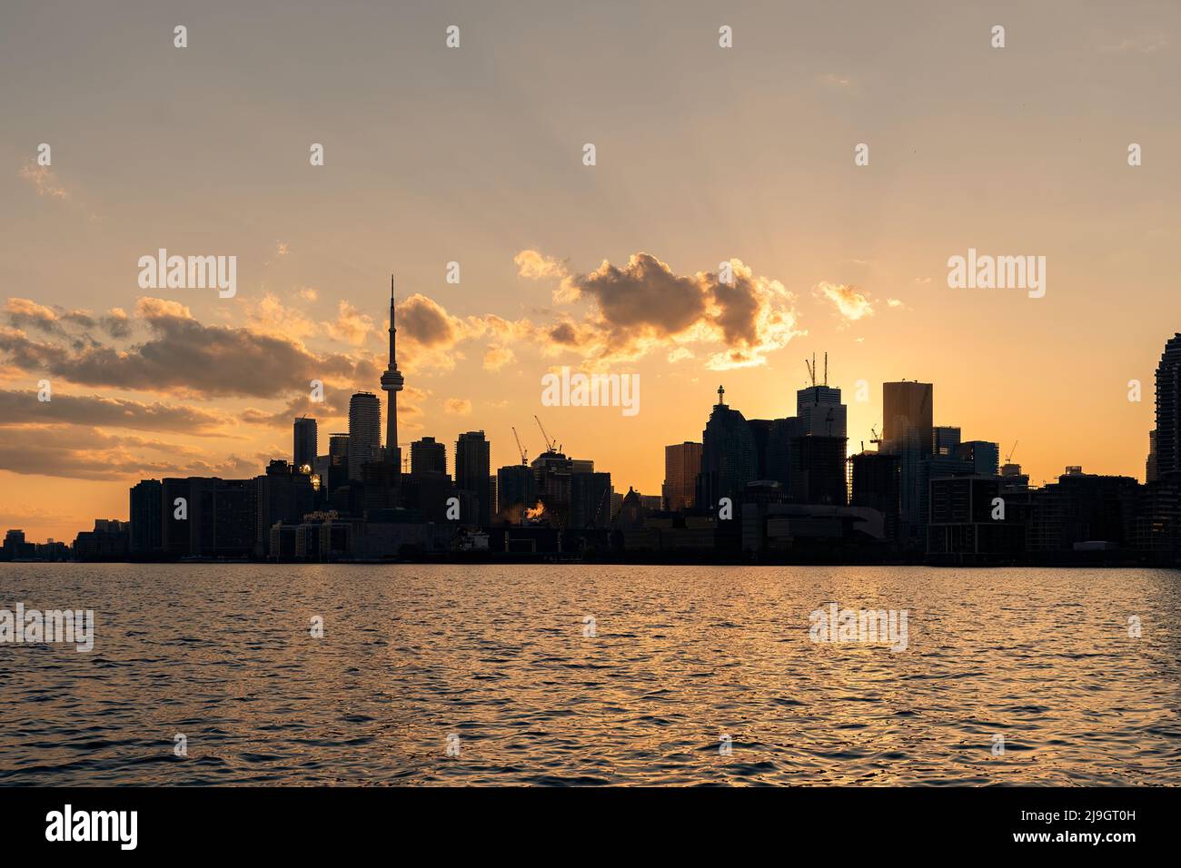 Toronto s skyline at dusk as seen from Polson Pier Stock Photo