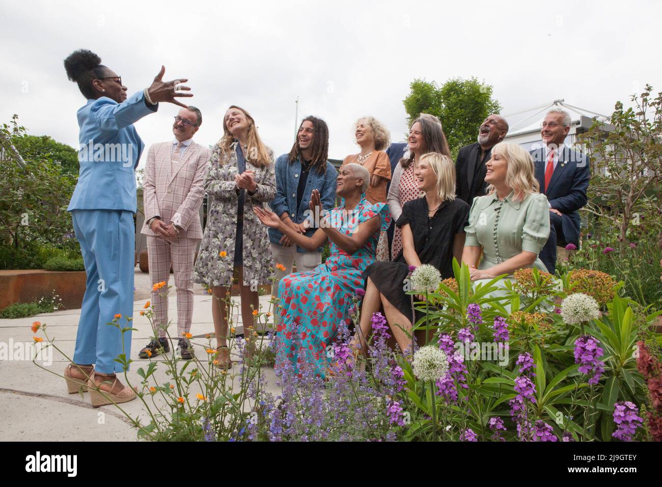 London, UK, 23 May 2022: Outgoing RHS ambassador Flowella BNenjamin, left, addresses the ten new ambassadors announced at Chelsea Flower Show, including Simon Lycett, Kate Bradbury, Tayshan Hayden Smith, Sue Kent, Mark Gregory, incoming RHS president Clare Matterson, Manoj Malde, James Alexander-Sinclair and seated Arit Anderson,  Jo Wiley and Nicki Chapman.  Anna Watson/Alamy Live News Stock Photo