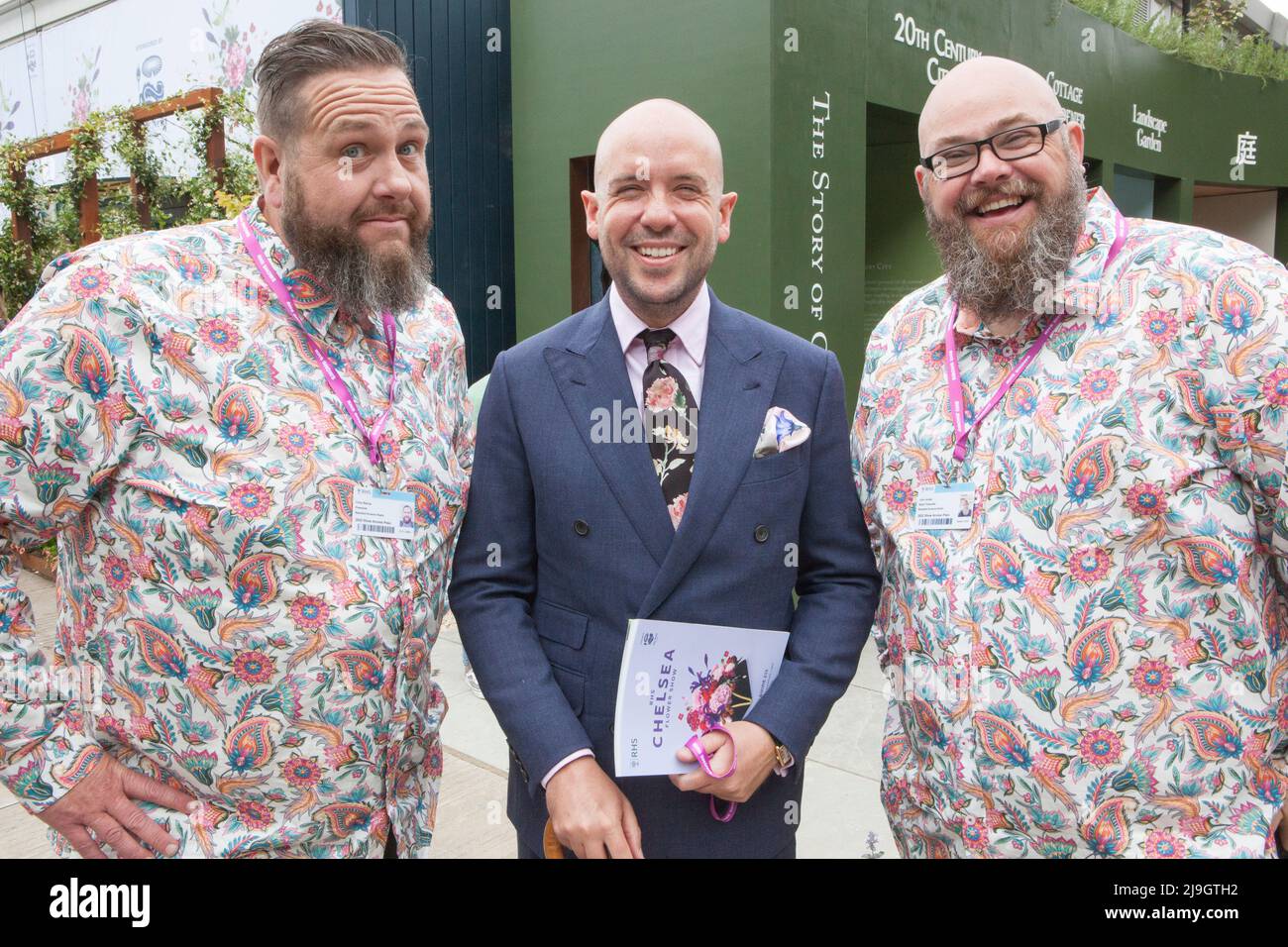 London, UK, 23 May 2022: Preview day at the Chelsea Flower Show. Comedian Tom Allen finds himself sandwiched bwetween the Bearded Growers radio presenters, Chris Bishop and John Jordon. Anna WAtson/Alamy Live News Stock Photo
