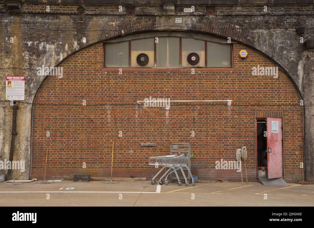 Small business redeveloped under railway arches by train and overground