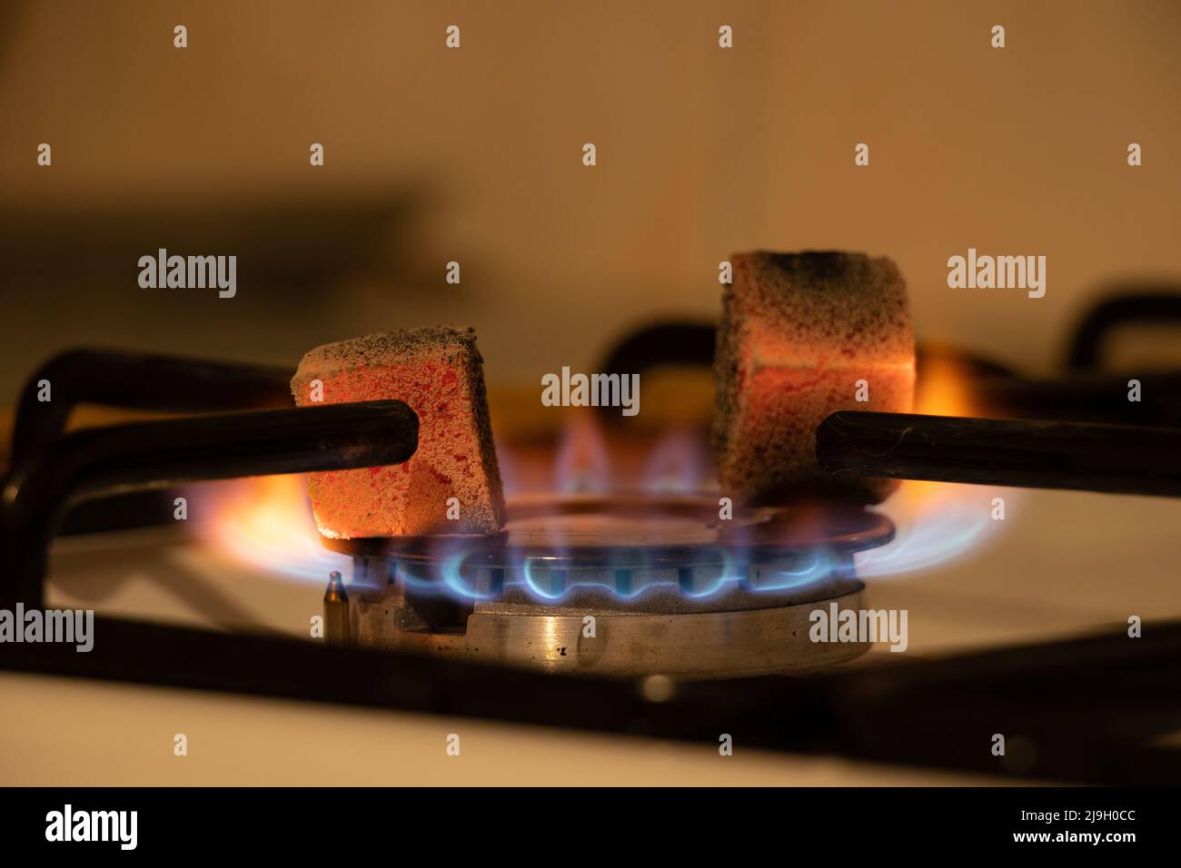 Gas stove in the kitchen with burning coals, burning gas in the kitchen