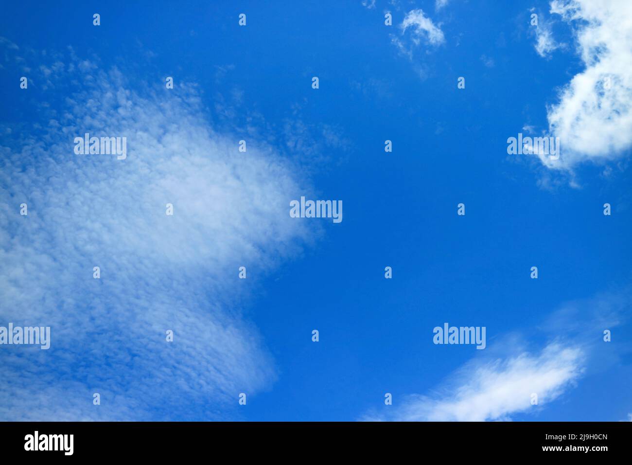 Vibrant Blue Sky with Spreading Pure White Clouds Stock Photo - Alamy
