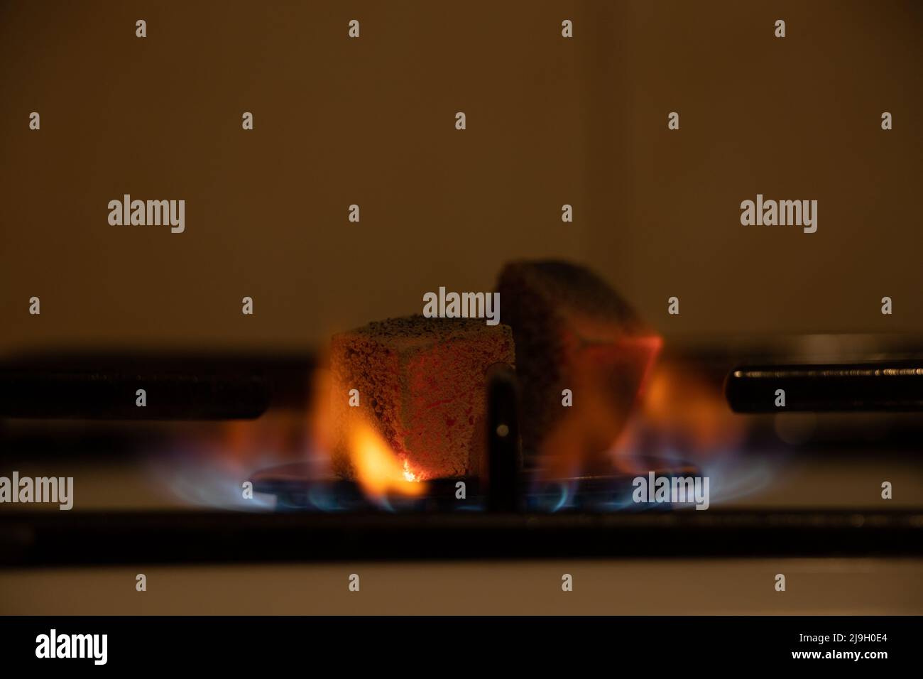 Gas stove in the kitchen with burning coals, burning gas in the kitchen