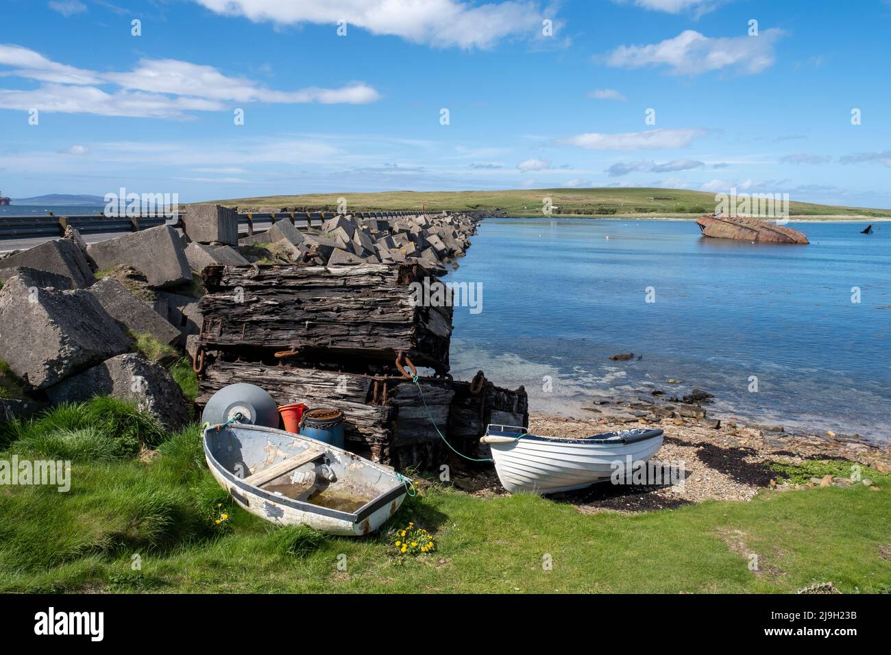 Churchill Barrier No.3 and 'block ship' partially submerged. The barrier links Glimps Holm and Burray, Orkney Islands, Scotland. Stock Photo