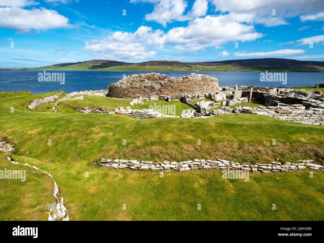 The Broch of Gurness is an Iron Age broch village on the northeast coast of Mainland Orkney in Scotland overlooking Eynhallow Sound. Stock Photo