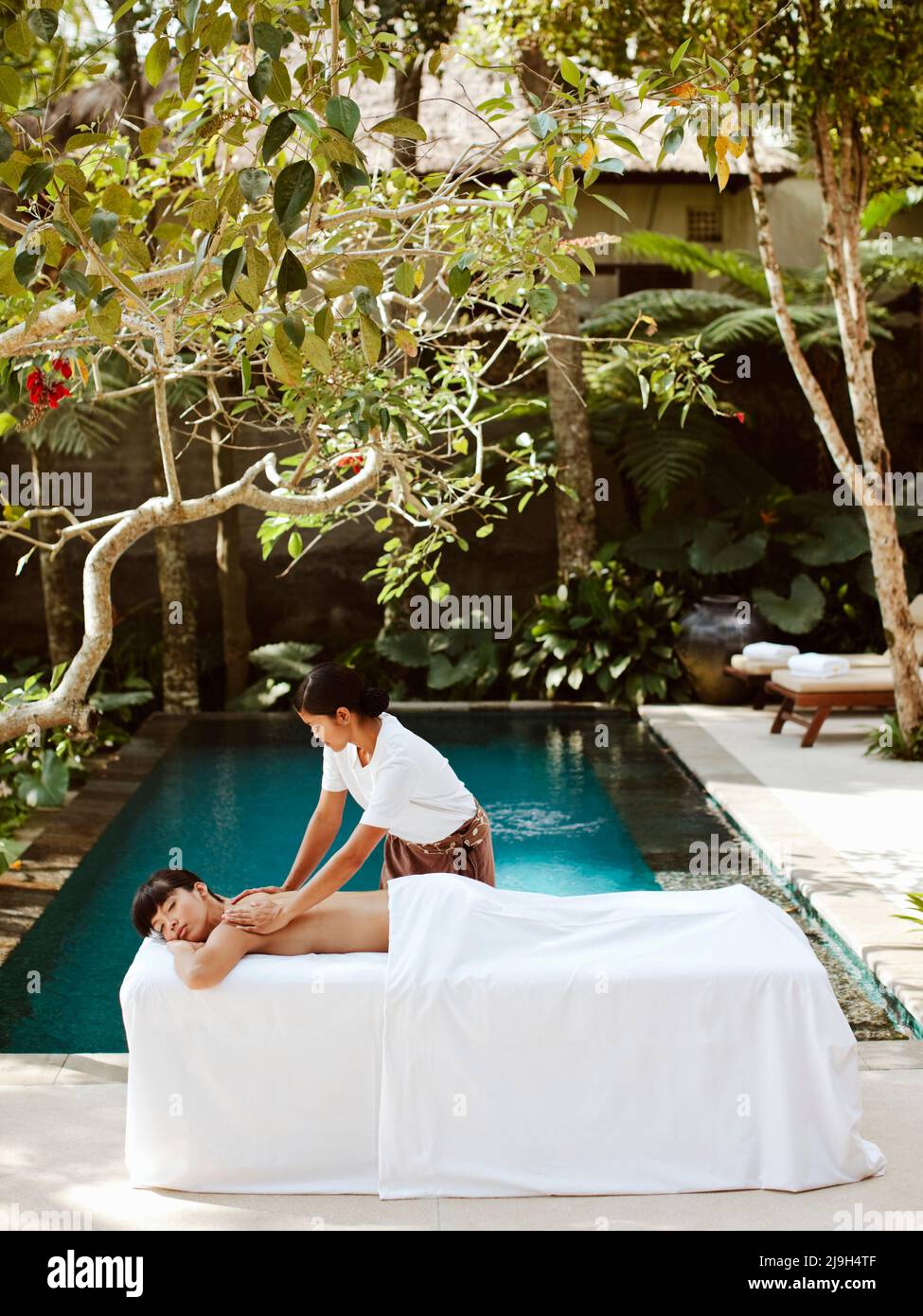 Woman receiving massage in private pool villa, Kayumanis Ubud, Bali, Indonesia Stock Photo Alamy