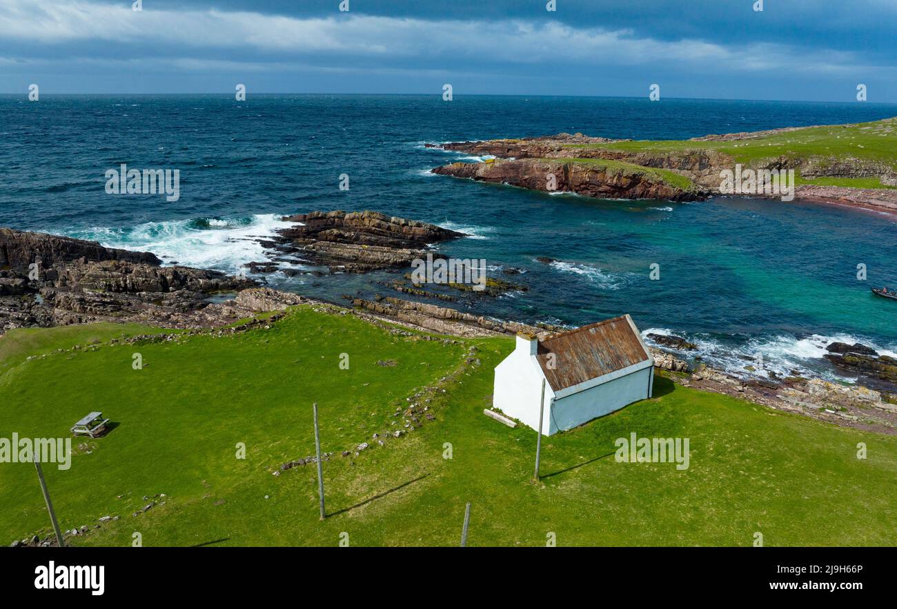 Aerial view from drone of old salmon fishing bothy at Clachtoll in Assynt, Sutherland, Highland, Scotland Stock Photo