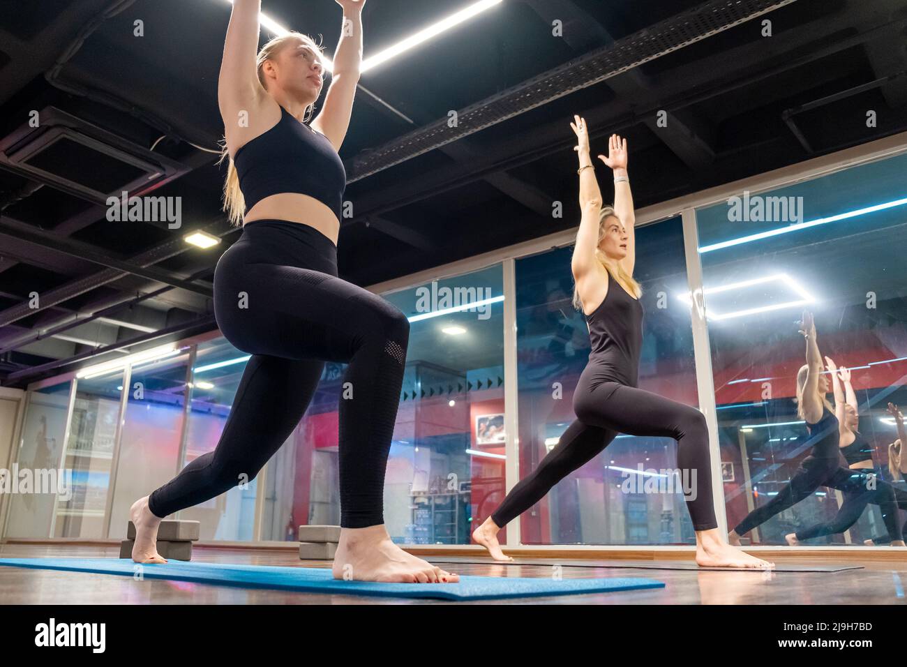 yoga teacher student group lesson practicing yoga teaching moves