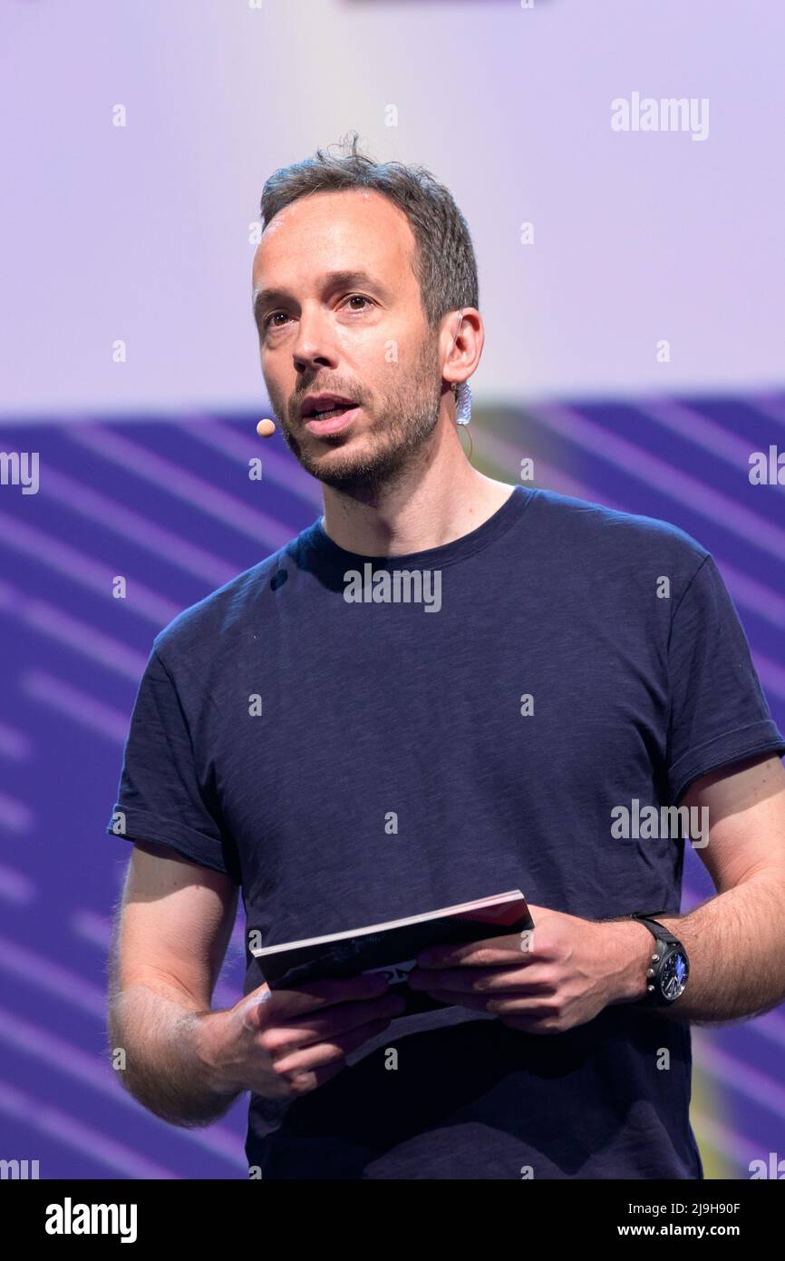 Hamburg, Germany. 18th May, 2022. OMR CEO Philipp Westermeyer moderates on a stage. The OMR digital festival in Hamburg focuses on a combination of trade fair, workshops and party. Credit: Jonas Walzberg/dpa/Alamy Live News Stock Photo