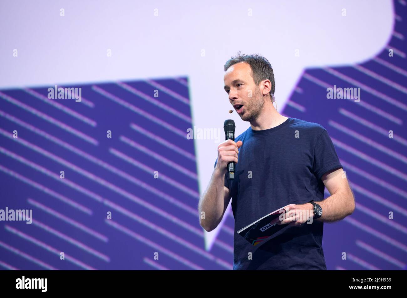 Hamburg, Germany. 18th May, 2022. OMR CEO Philipp Westermeyer moderates on a stage. The OMR digital festival in Hamburg focuses on a combination of trade fair, workshops and party. Credit: Jonas Walzberg/dpa/Alamy Live News Stock Photo