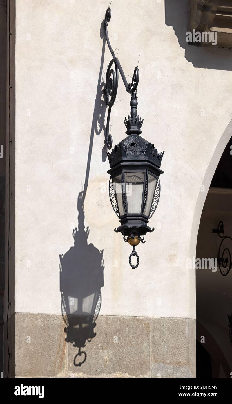 https://c8.alamy.com/comp/2J9H9MY/krakow-poland-may-16-2022-ornate-lantern-lamps-on-the-outside-of-the-cloth-hall-with-shadow-2J9H9MY.jpg