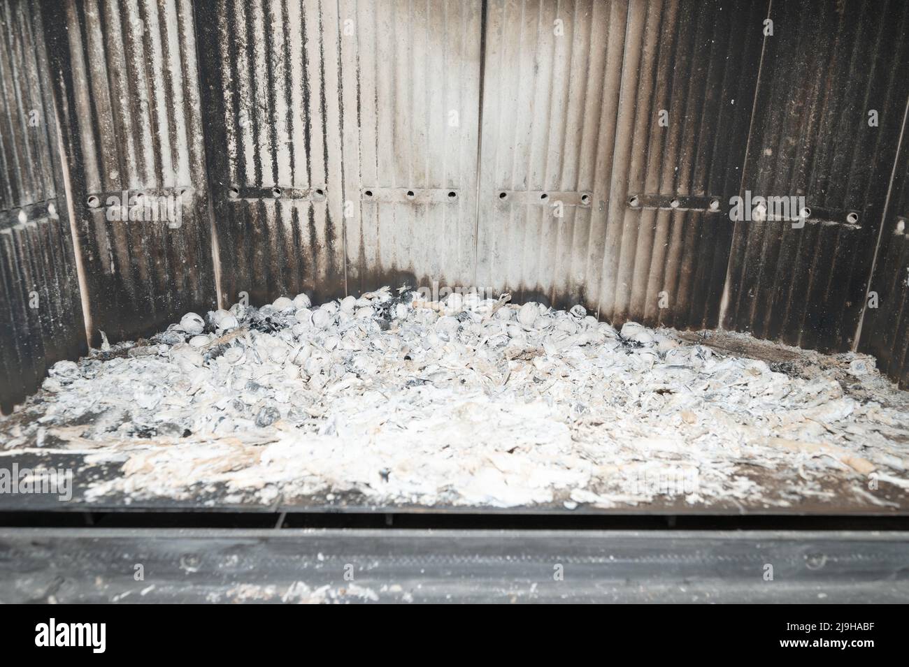 Fireplace and ashes close up, fireplace in the middle with fireclay