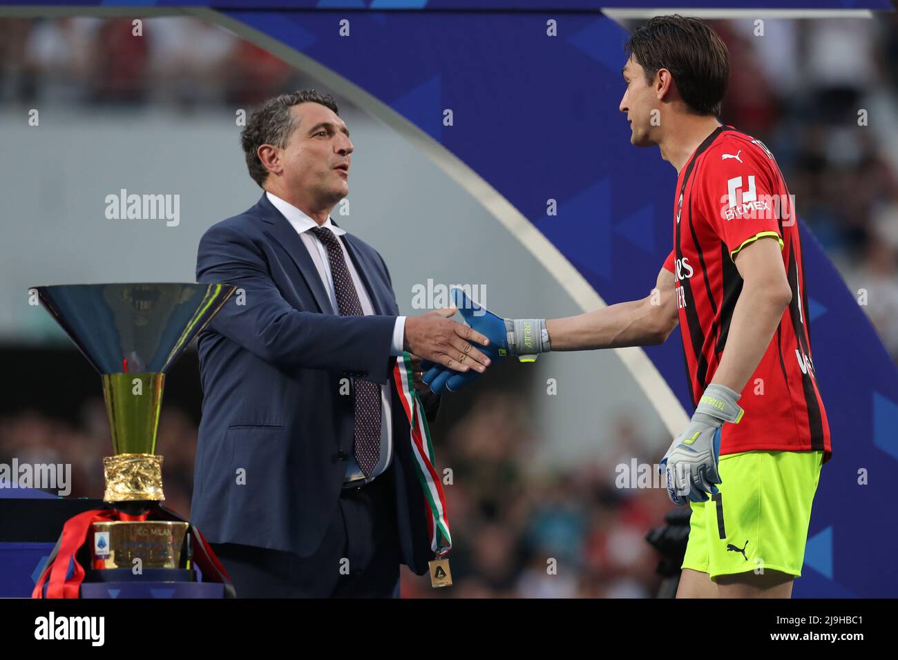 Sassuolo, Italy, 22nd May 2022. Ciprian Tatarusanu of AC Milan shakes hands with Luigi De Siervo Managing Director of Serie A as he steps on to the winners' podium to collect his medal during the trophy presentation following the Serie A match at Mapei Stadium - Cittˆ del Tricolore, Sassuolo. Picture credit should read: Jonathan Moscrop / Sportimage Stock Photo