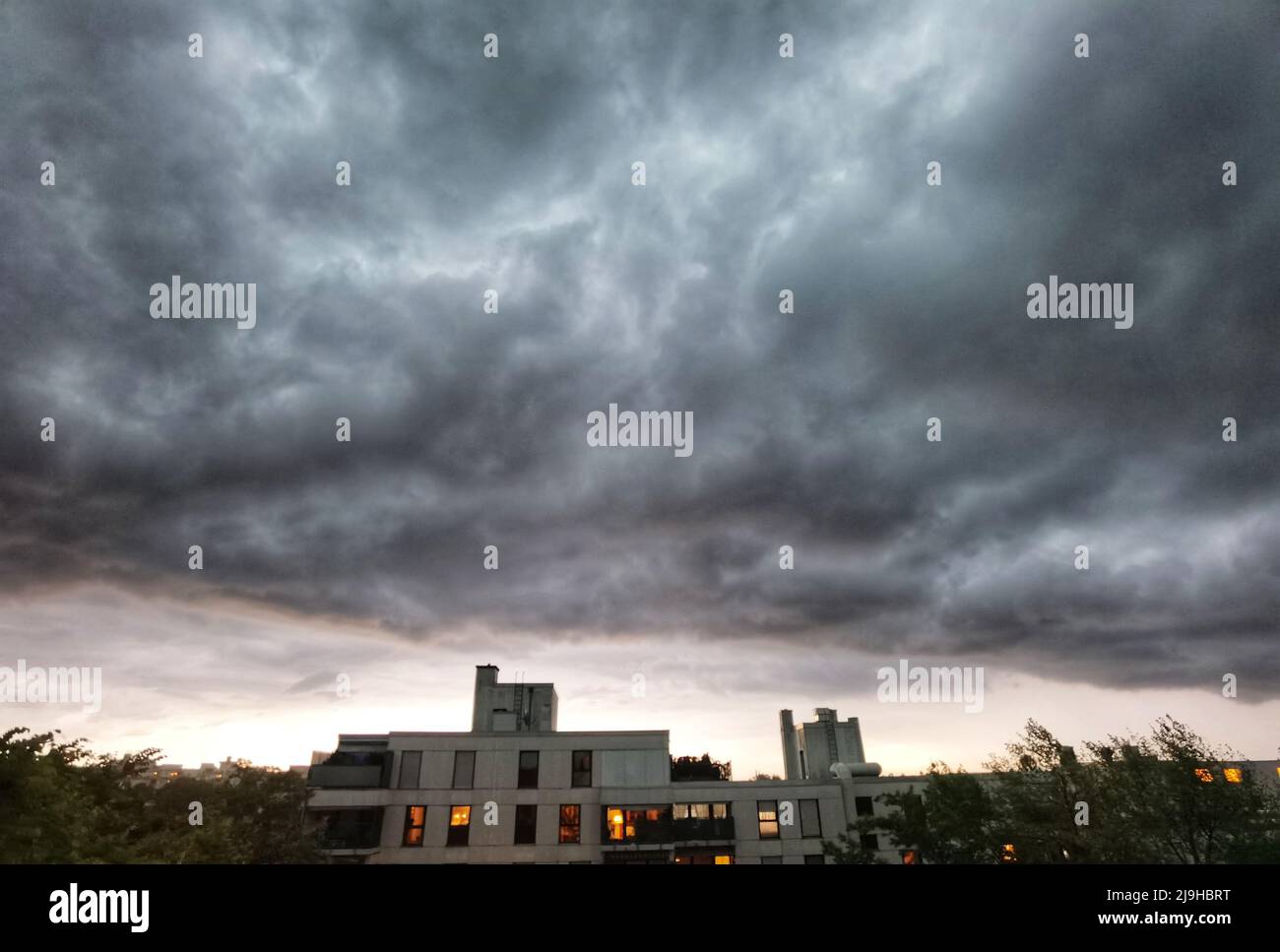 Munich, Bavaria, Germany. 23rd May, 2022. Ominous storm clouds over Munich, Germany signal the arrival of a cold front and drop in local atmospheric pressure that is expected to bring torrential rains, hail, and possibly tornados to parts of southern and central Germany. (Credit Image: © Sachelle Babbar/ZUMA Press Wire) Stock Photo