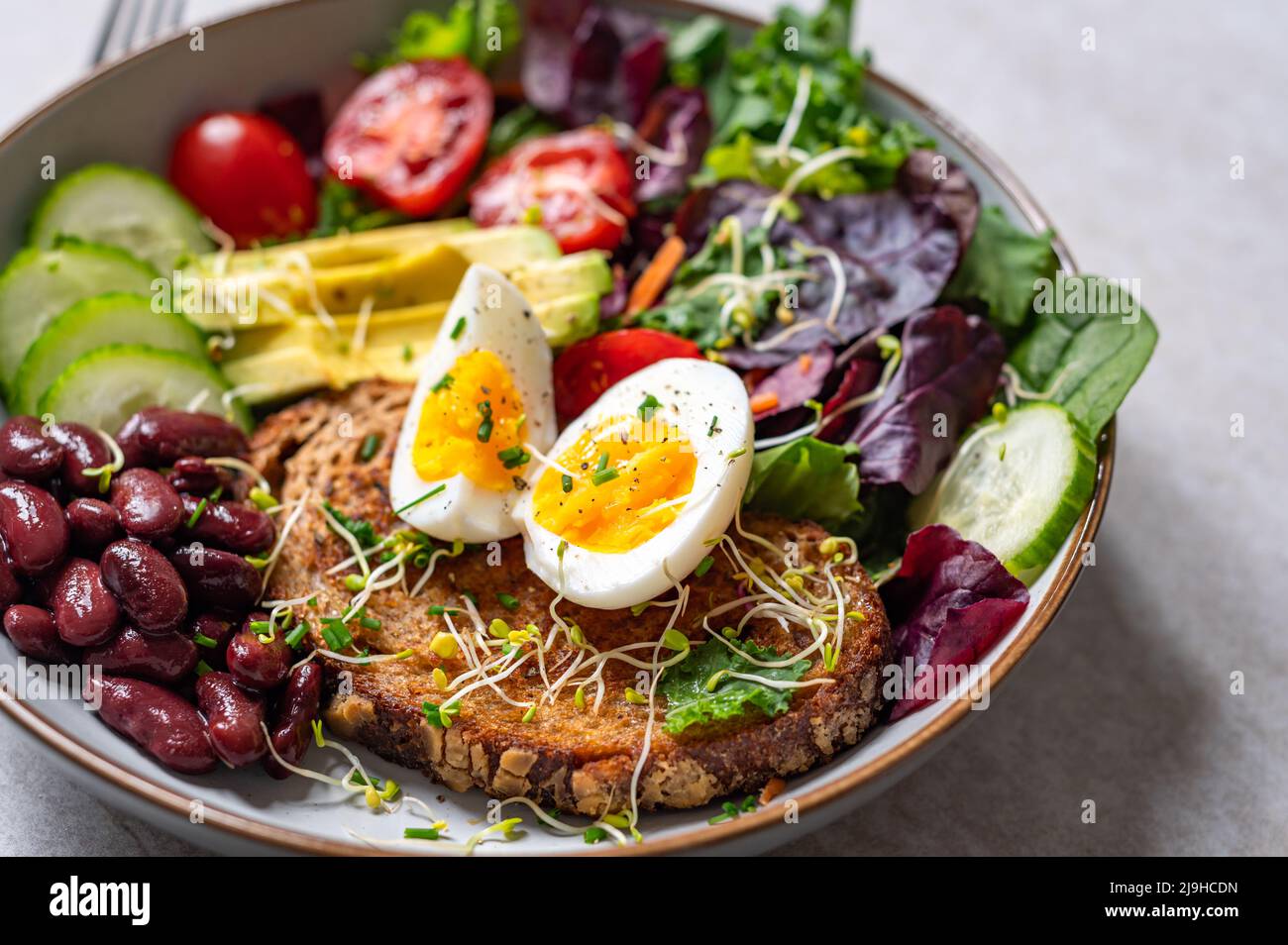 Medium boiled eggs with sasld, healthy breakfast Stock Photo