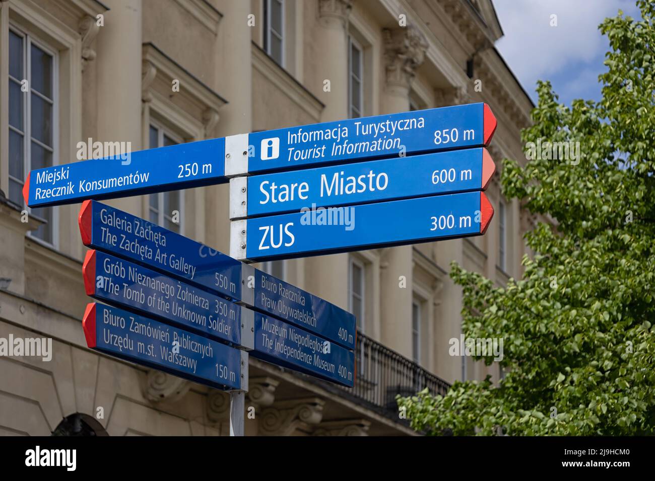 WARSAW, POLAND - MAY 17, 2022:  Signpost in the Old Town with directions to Stare Miasto and Tourist Information Stock Photo