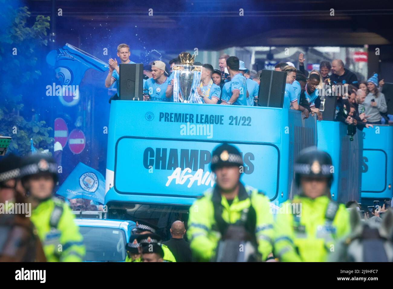 Manchester, UK. 23rd May, 2022. Manchester City celebrate winning their forth Premier League title in five years with a parade through the city. Thousands of fans lined the streets to welcome Guardiola and the squad as they travelled through the city showing off the latest trophy. Credit: Andy Barton/Alamy Live News Stock Photo