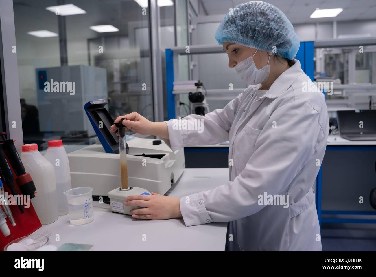 Kazan, Russia. May 10, 2022. Woman scientist testing a flask with a chemical composition. ork pharmacist. Pharmacology. Chemical laboratory. Stock Photo