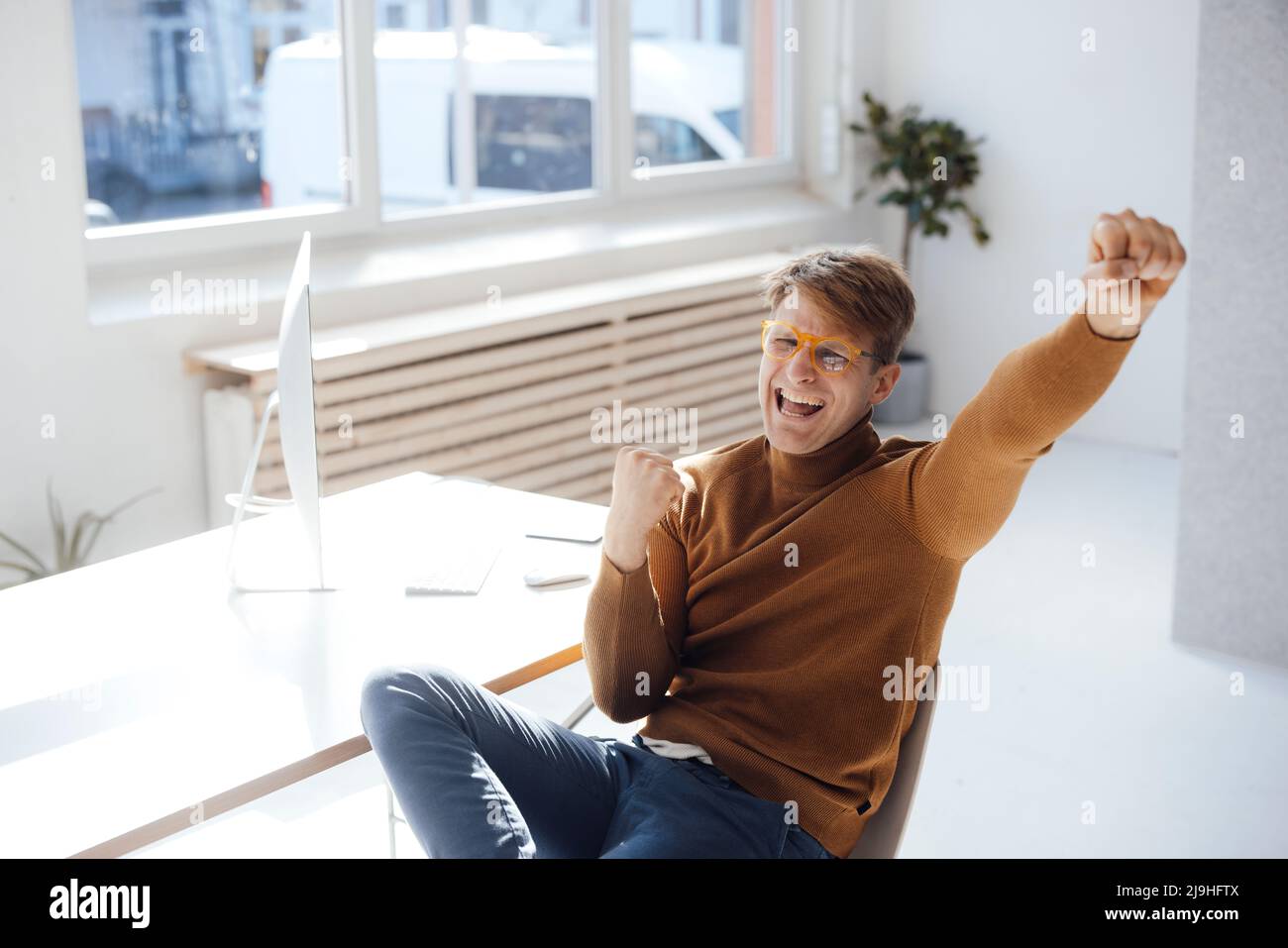 Cheering businessman desk in hi-res stock photography and images - Alamy