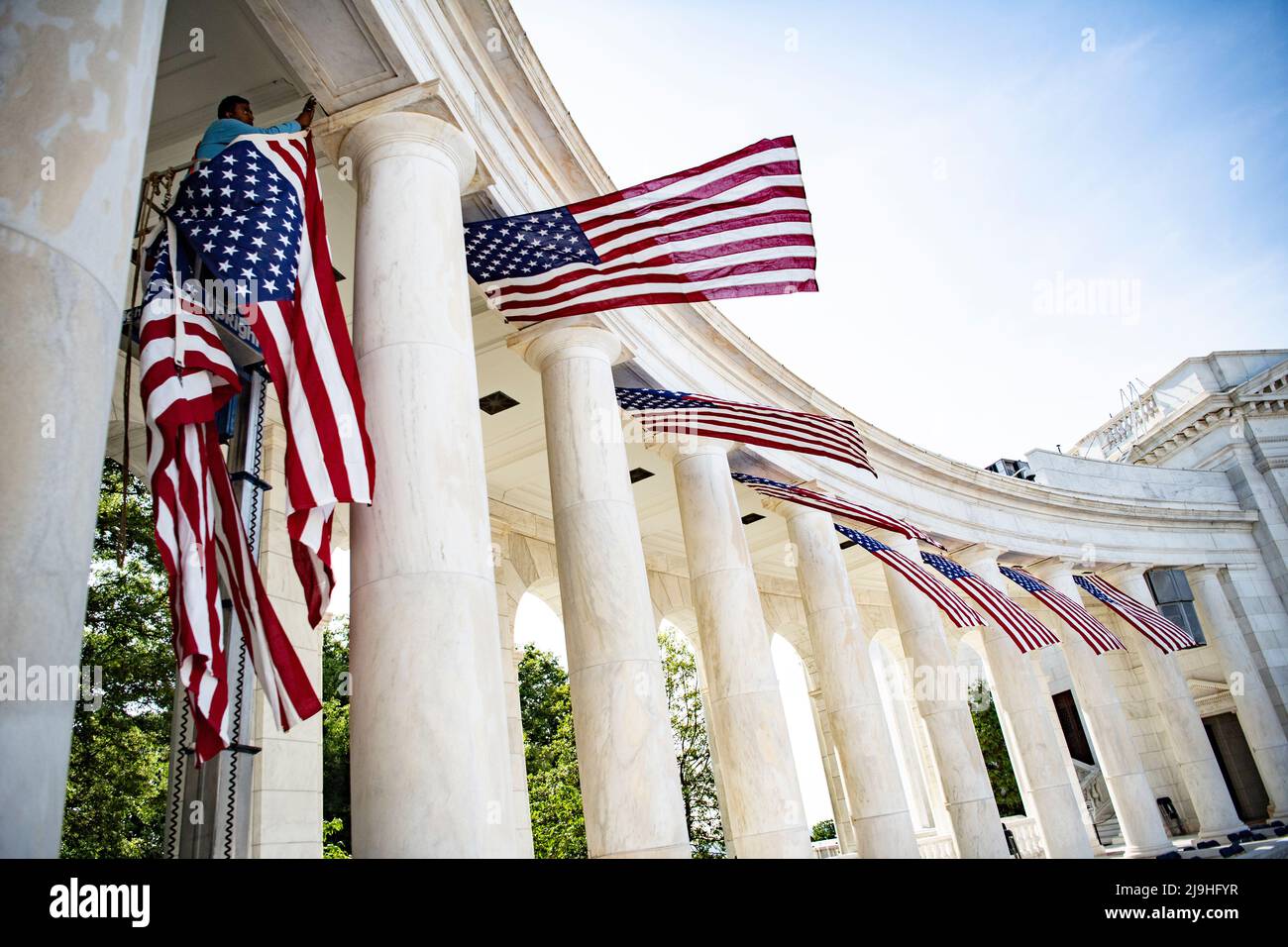 Arlington, United States Of America. 23rd May, 2022. Arlington, United States of America. 23 May, 2022. Facilities maintenance employees hang American flags in the Arlington National Cemetery Memorial Amphitheater in preparation for the annual Memorial Day event honoring the nations war dead, May 23, 2022 in Arlington, Virginia, USA. Credit: Elizabeth Fraser/U.S. Army/Alamy Live News Stock Photo
