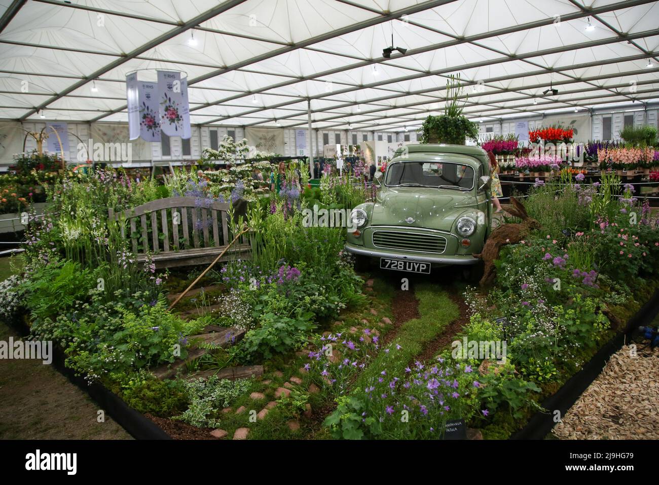 Range Rover Chelsea Flower Show London, UK - 23 May 2022 , A vintage car within a garden display at the ...