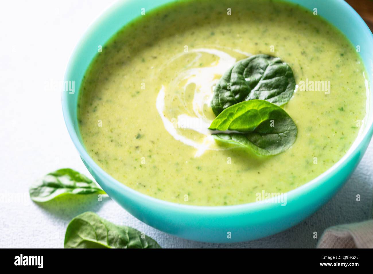 Green soup. Spinach cream soup with cream Stock Photo - Alamy