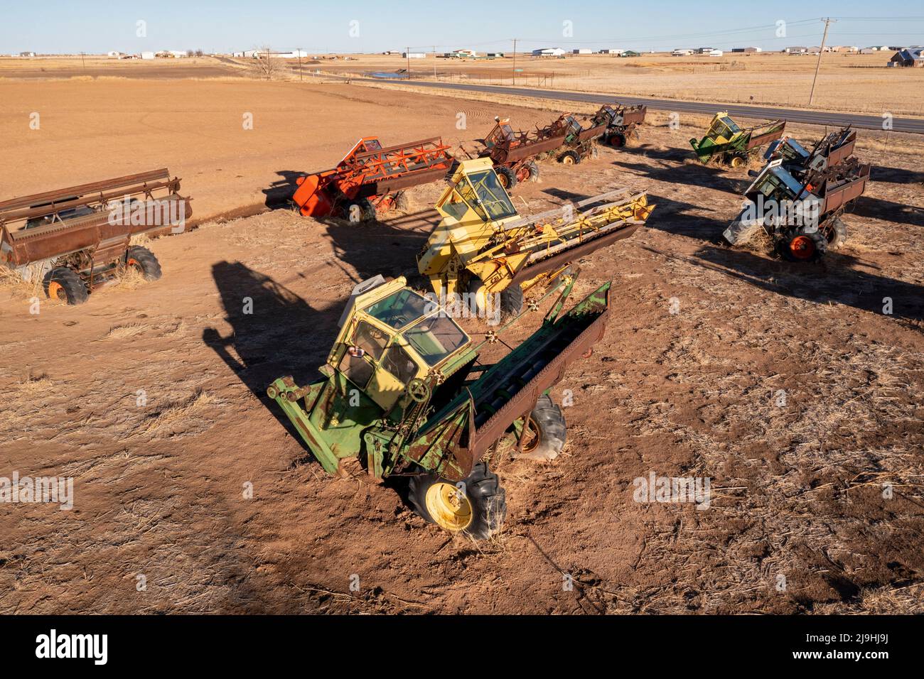 Canyon, Texas - Combine City, where a dozen old farm combines are partially buried in a field. Combine City is an imitation of the nearby better-known Stock Photo