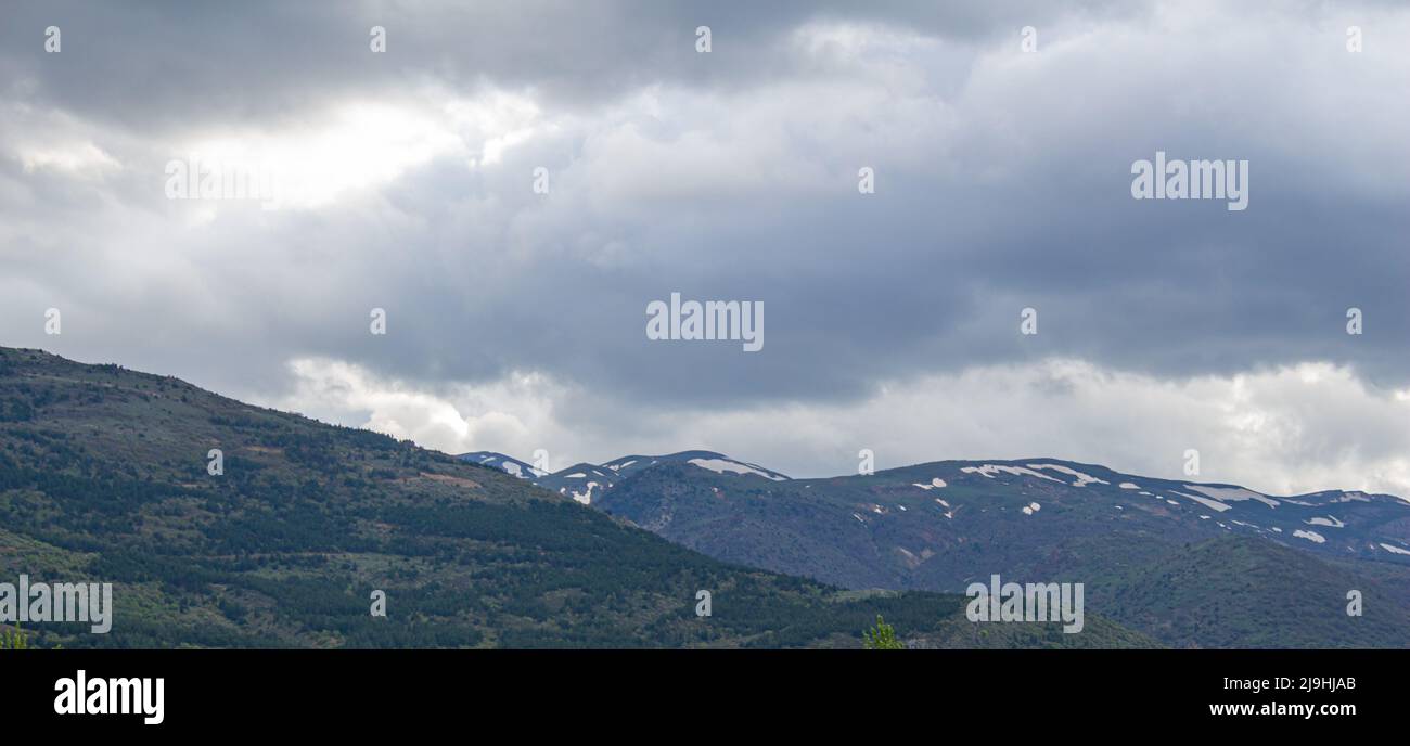 Landscape photo of mountains with cloudy sky Stock Photo - Alamy