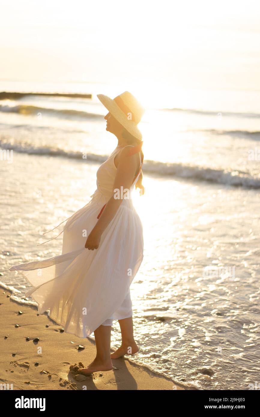 Mature woman beach wind hi-res stock photography and images - Alamy