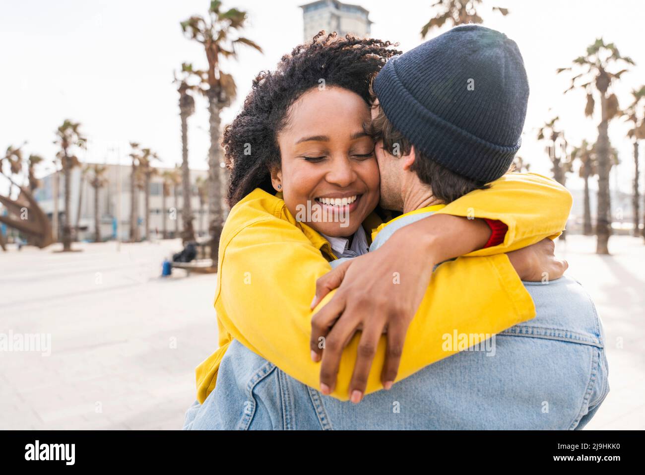 Woman man hugging friends hi-res stock photography and images - Alamy