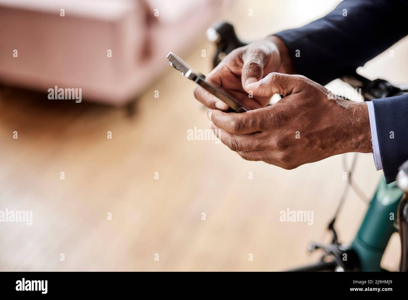 Businessman using smart phone at home Stock Photo
