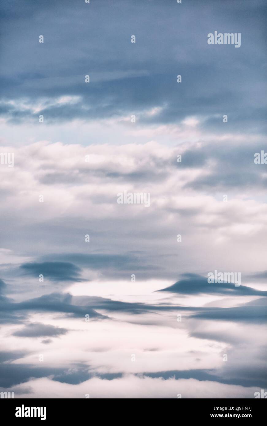 White and gray cloudscape at dusk Stock Photo