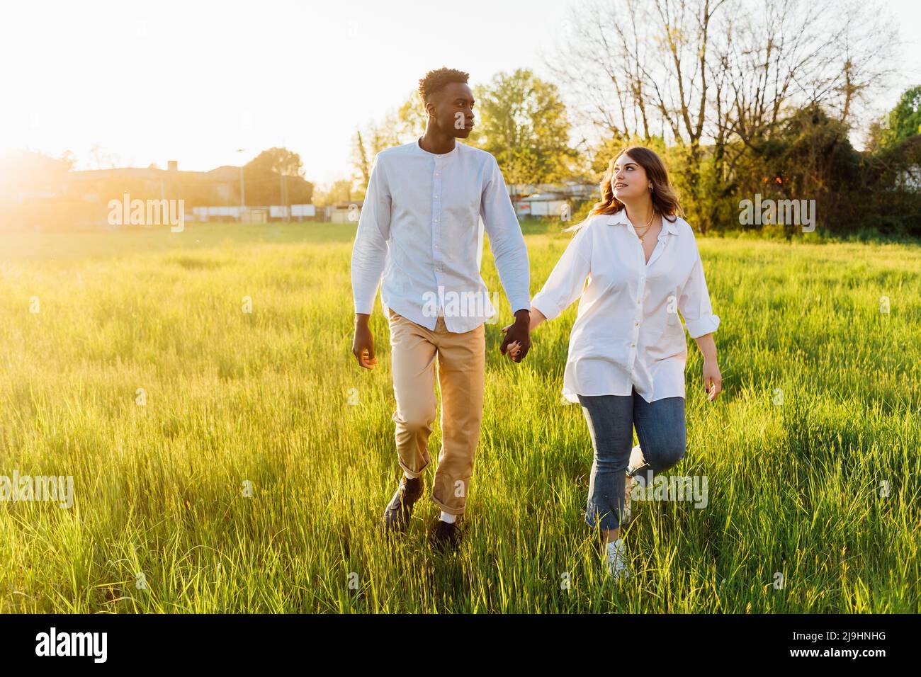 Couple holding hands walking hi-res stock photography and images - Alamy