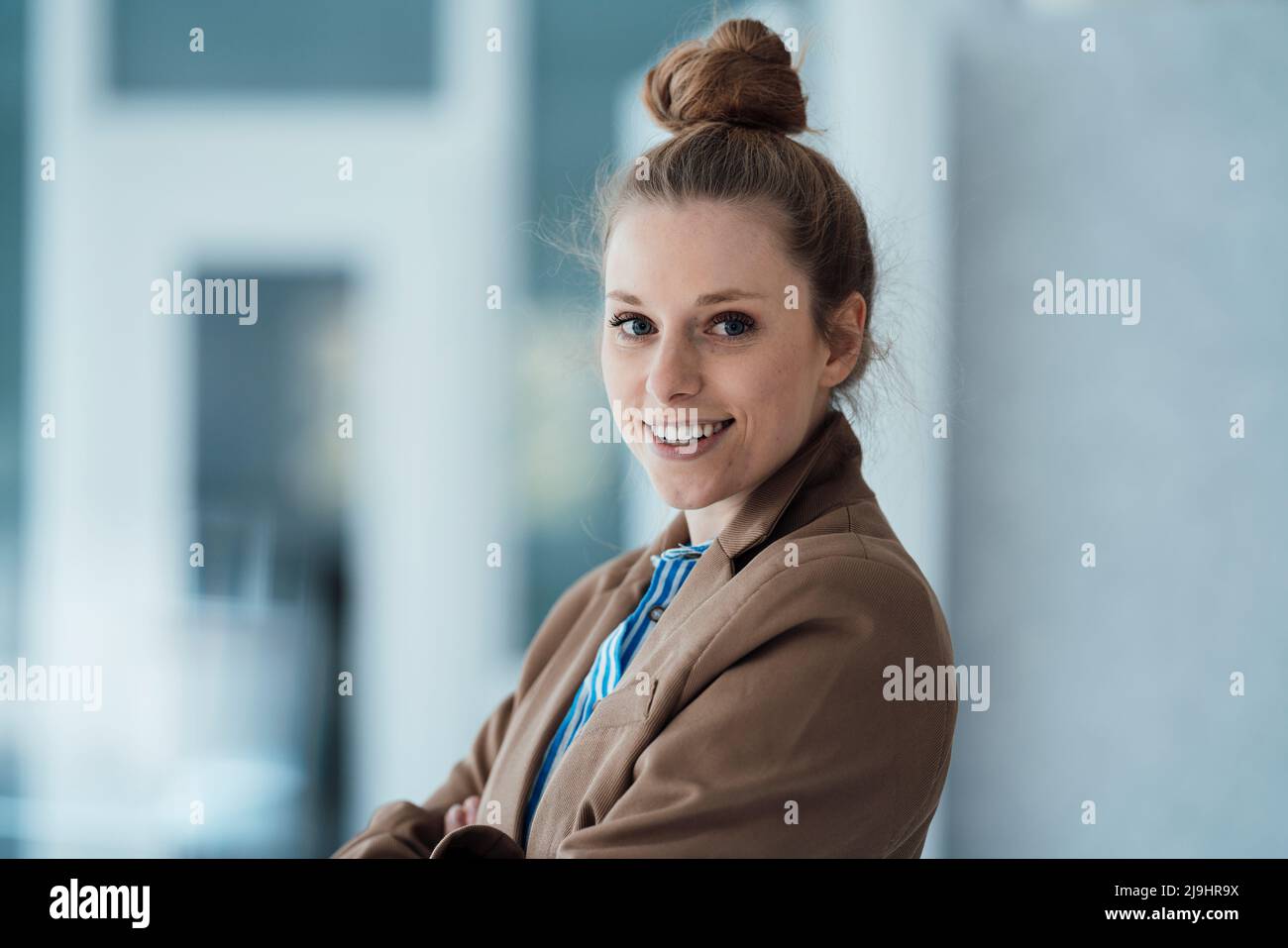 Female wearing brown blazer hi-res stock photography and images - Alamy