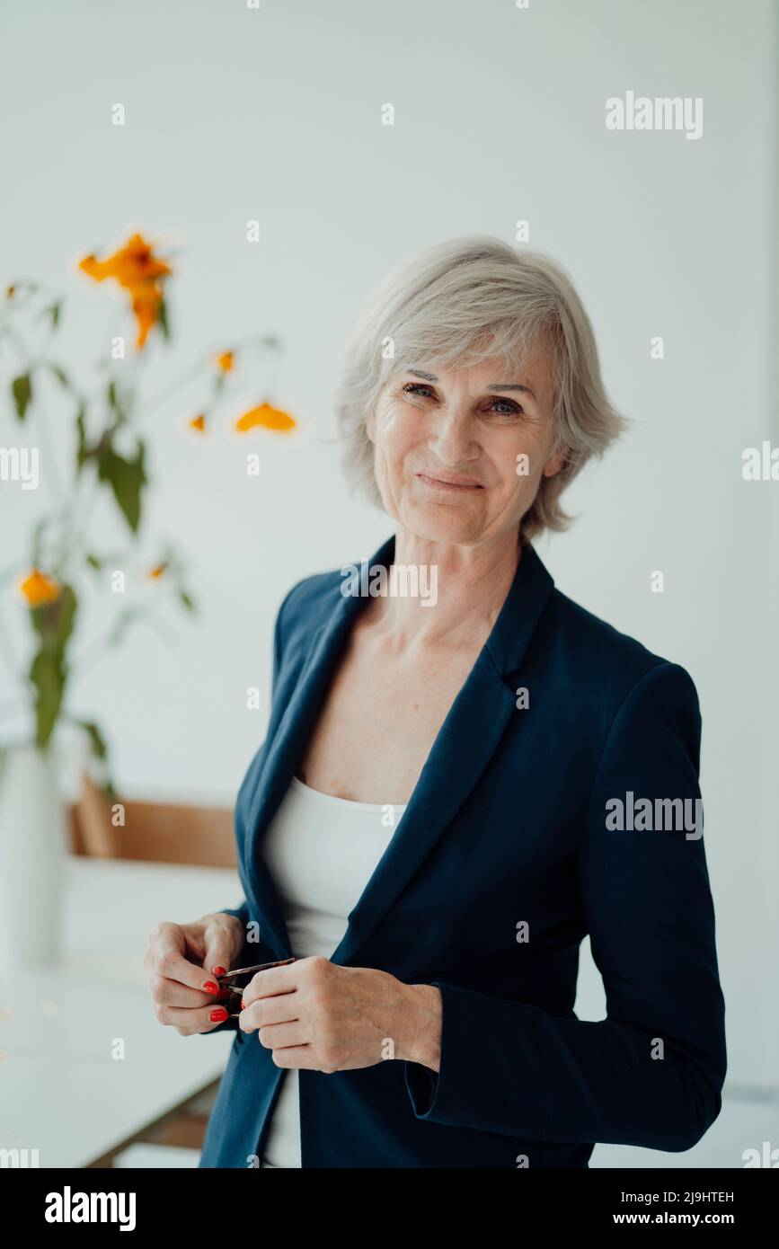 Senior woman wearing blazer hi-res stock photography and images - Alamy