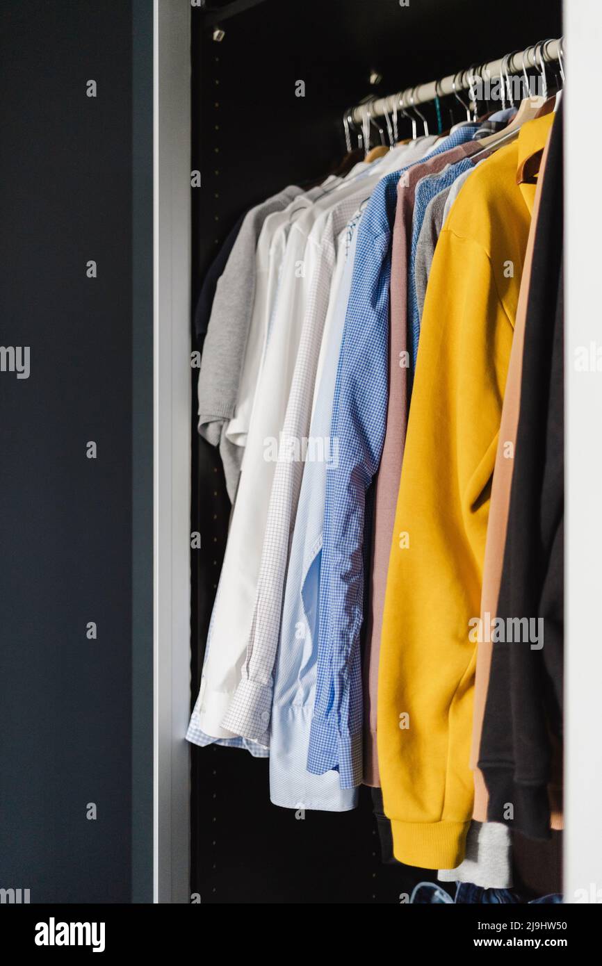 Clothes arranged in closet at home Stock Photo Alamy