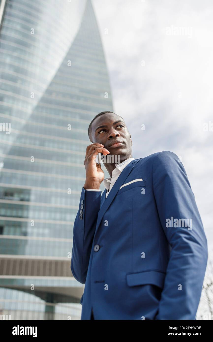 Young businessman talking on mobile phone Stock Photo