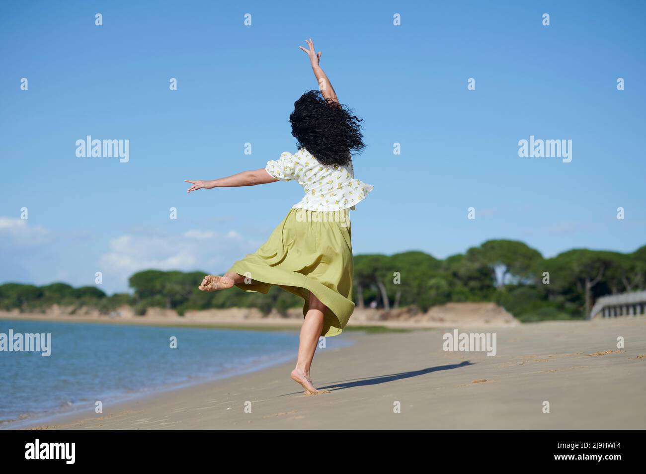 Woman dancing barefoot on sand hi-res stock photography and images - Alamy