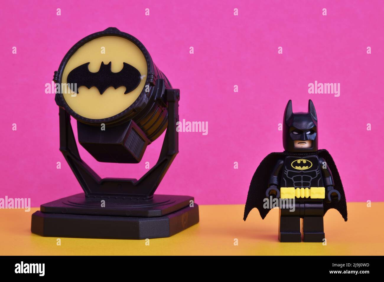 Bologna Italy May 23 2022 Lego Batman miniature with Batsignal on display isolated on pastel color background Stock Photo Alamy