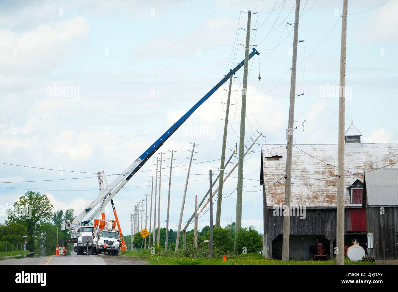 Hydro Crews work to fix broken power poles and restore power in the ...