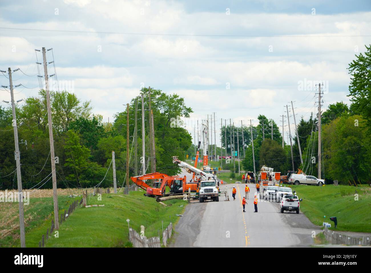 Hydro Crews work to fix broken power poles and restore power in the ...